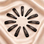Black clips on satin fabric