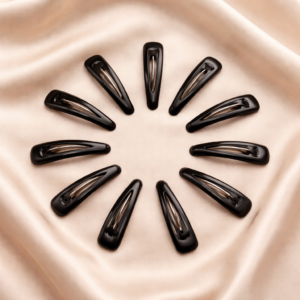 Black clips on satin fabric