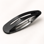 Black snap hair clip close-up