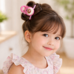 Smiling girl with pink bear clip